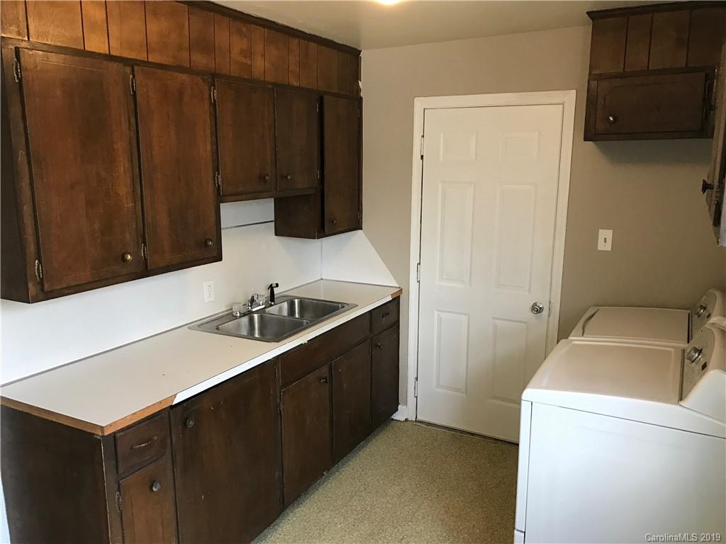 1221 Gold Hill Road Fort Mill, SC 29708 - Photo 25 of 32 a kitchen with a sink and a refrigerator