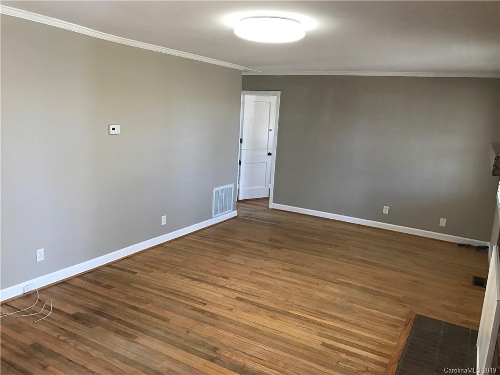 1221 Gold Hill Road Fort Mill, SC 29708 - Photo 4 of 32 a view of an empty room with wooden floor