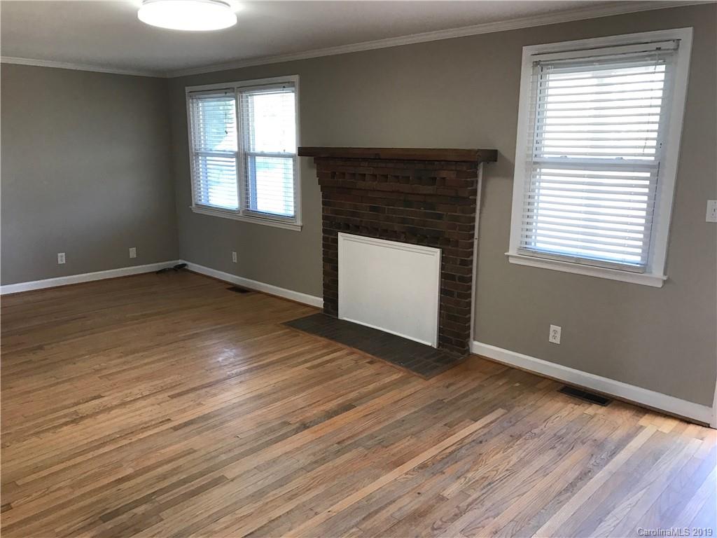 1221 Gold Hill Road Fort Mill, SC 29708 - Photo 5 of 32 an empty room with wooden floor and windows