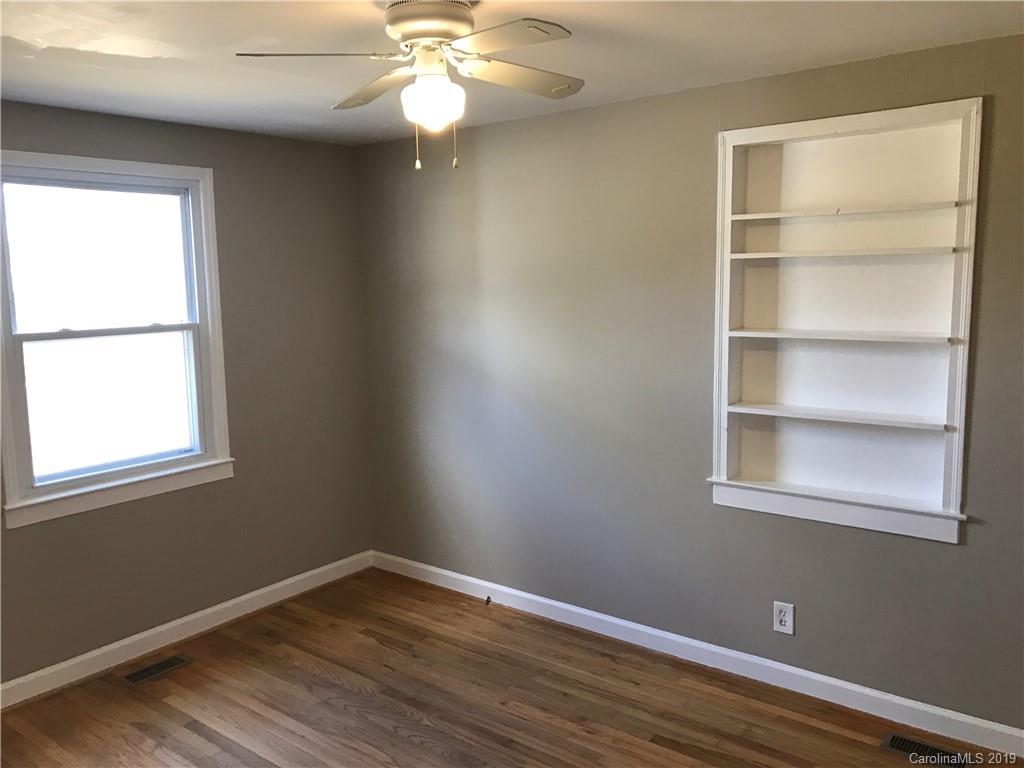 1221 Gold Hill Road Fort Mill, SC 29708 - Photo 6 of 32 a view of an empty room with wooden floor and a window