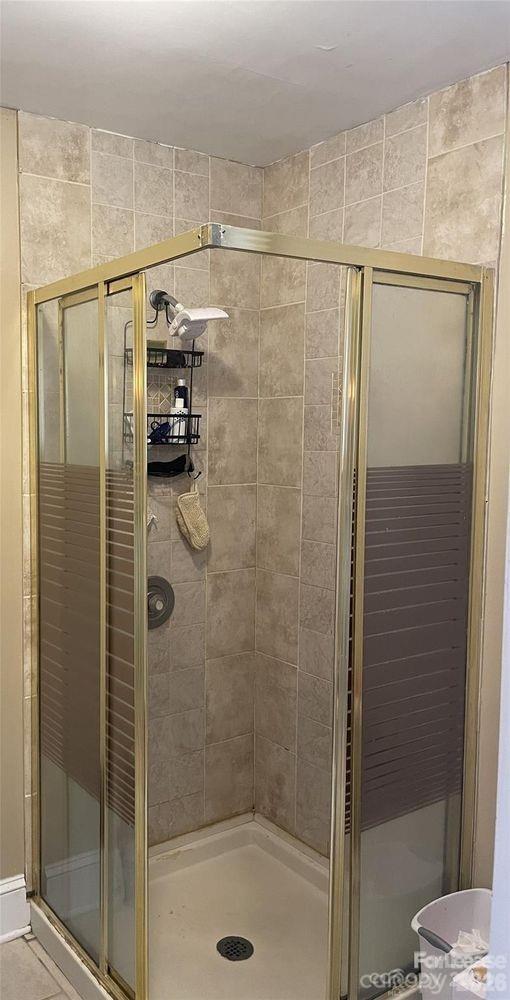 3800 Oldfield Road Charlotte, NC 28226 - Photo 17 of 32 a bathroom with a shower and a sink