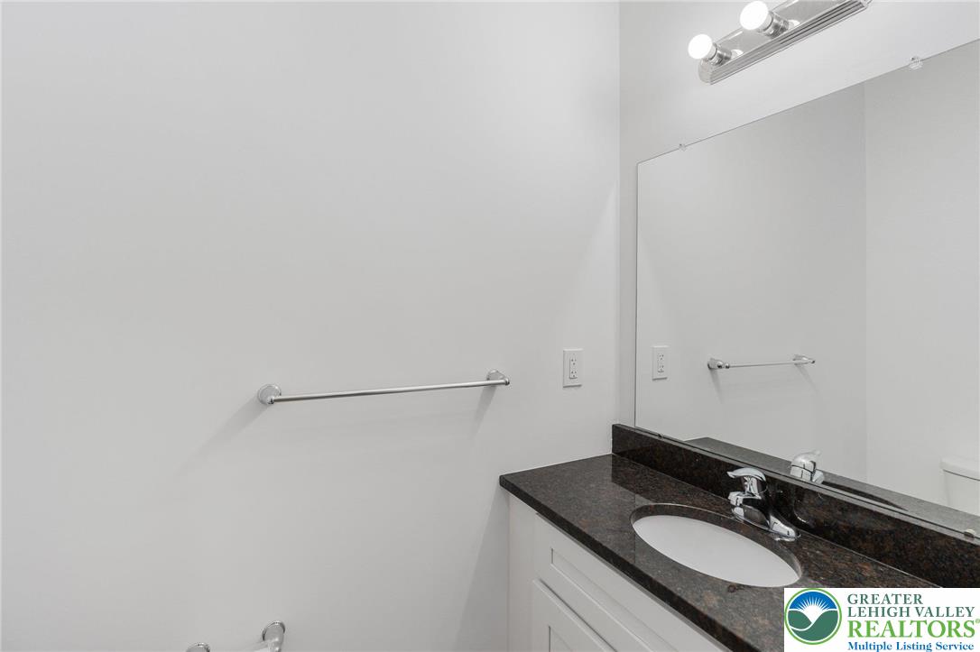 306 Barber Street, Unit LOT 39 Allentown, PA 18103 - Photo 17 of 30 a bathroom with a sink and a mirror