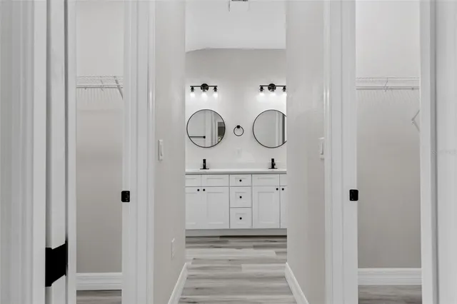 a bathroom with a sink and vanity