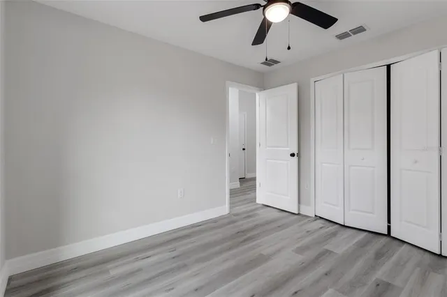 a spacious bathroom with a double vanity sink and a mirror