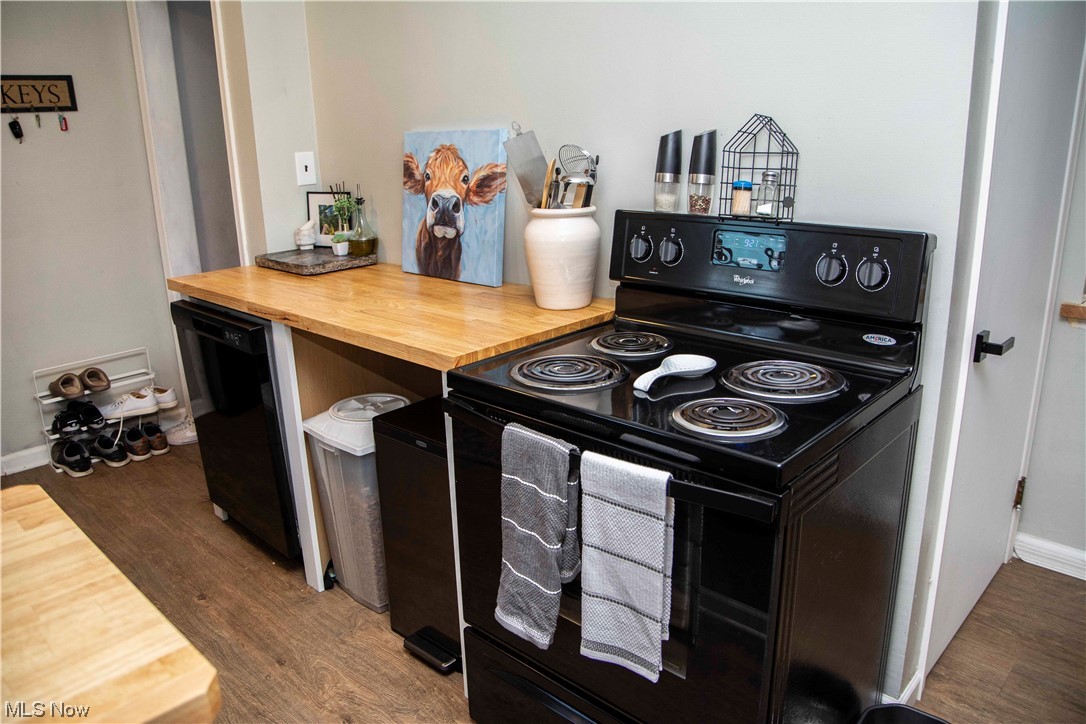 2658 Brunswick Road Youngstown, OH 44511 - Photo 20 of 33 Kitchen with butcher block countertops, black appliances, and new flooring