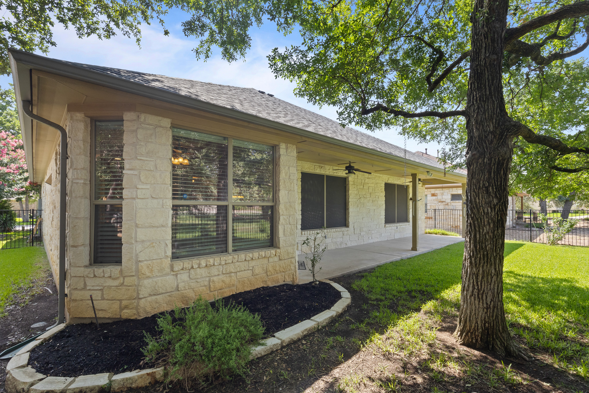 1005 Fort Davis Street Georgetown, TX 78633 - Photo 25 of 38 View of side of property with ceiling fan & large covered patio.