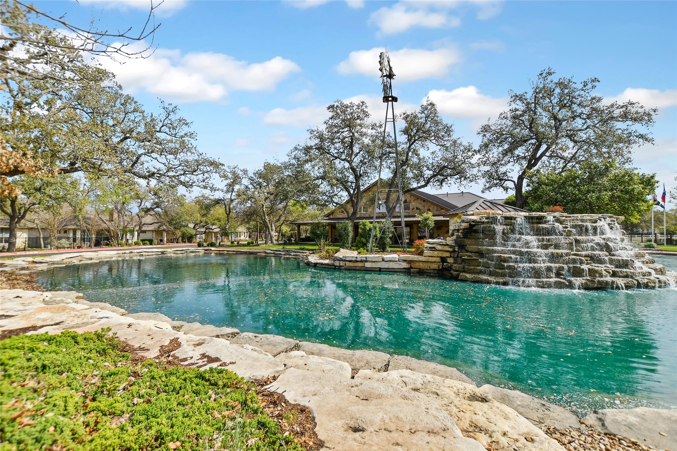 1005 Fort Davis Street Georgetown, TX 78633 - Photo 30 of 38 Heritage Oaks waterfall, windmill and pond.