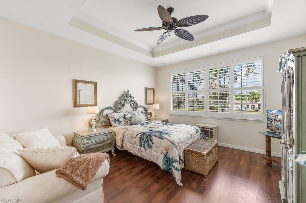 3951 Cherrybrook Loop Fort Myers, FL 33966 - Photo 12 of 34 a spacious bedroom with a bed couch and a window