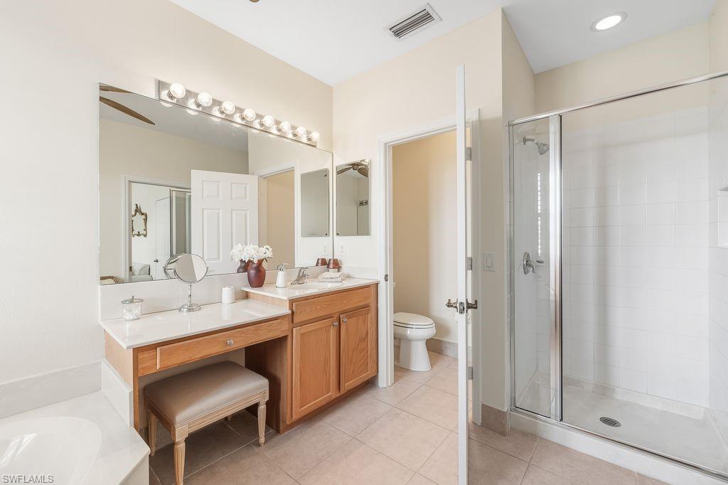 3951 Cherrybrook Loop Fort Myers, FL 33966 - Photo 14 of 34 a bathroom with a double vanity sink mirror and toilet