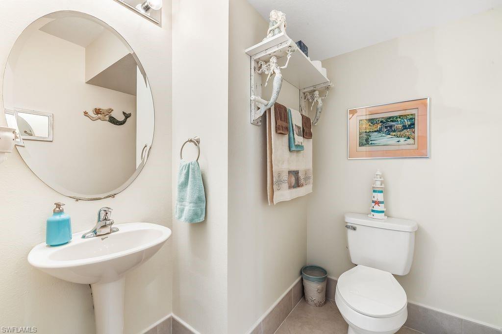 3951 Cherrybrook Loop Fort Myers, FL 33966 - Photo 17 of 34 a bathroom with a toilet sink and mirror