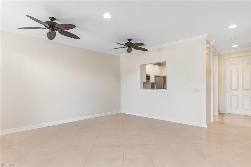3951 Cherrybrook Loop Fort Myers, FL 33966 - Photo 9 of 34 an empty room with a ceiling fan and windows