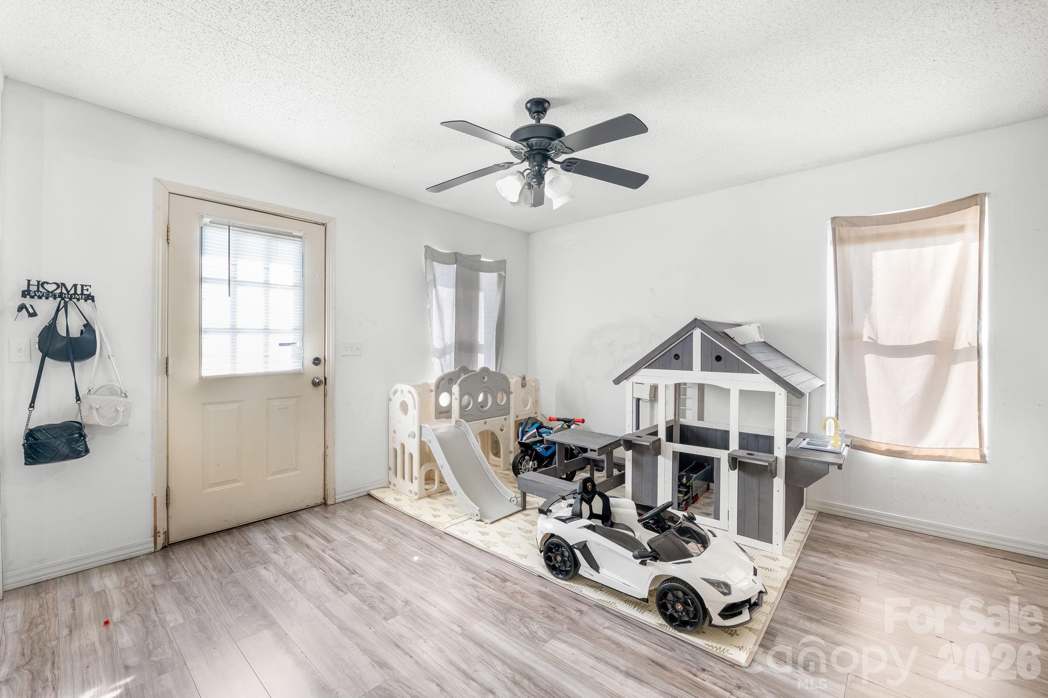 3761 Herman Sipe Road Conover, NC 28613 - Photo 12 of 27 a view of a livingroom with furniture and hardwood floor