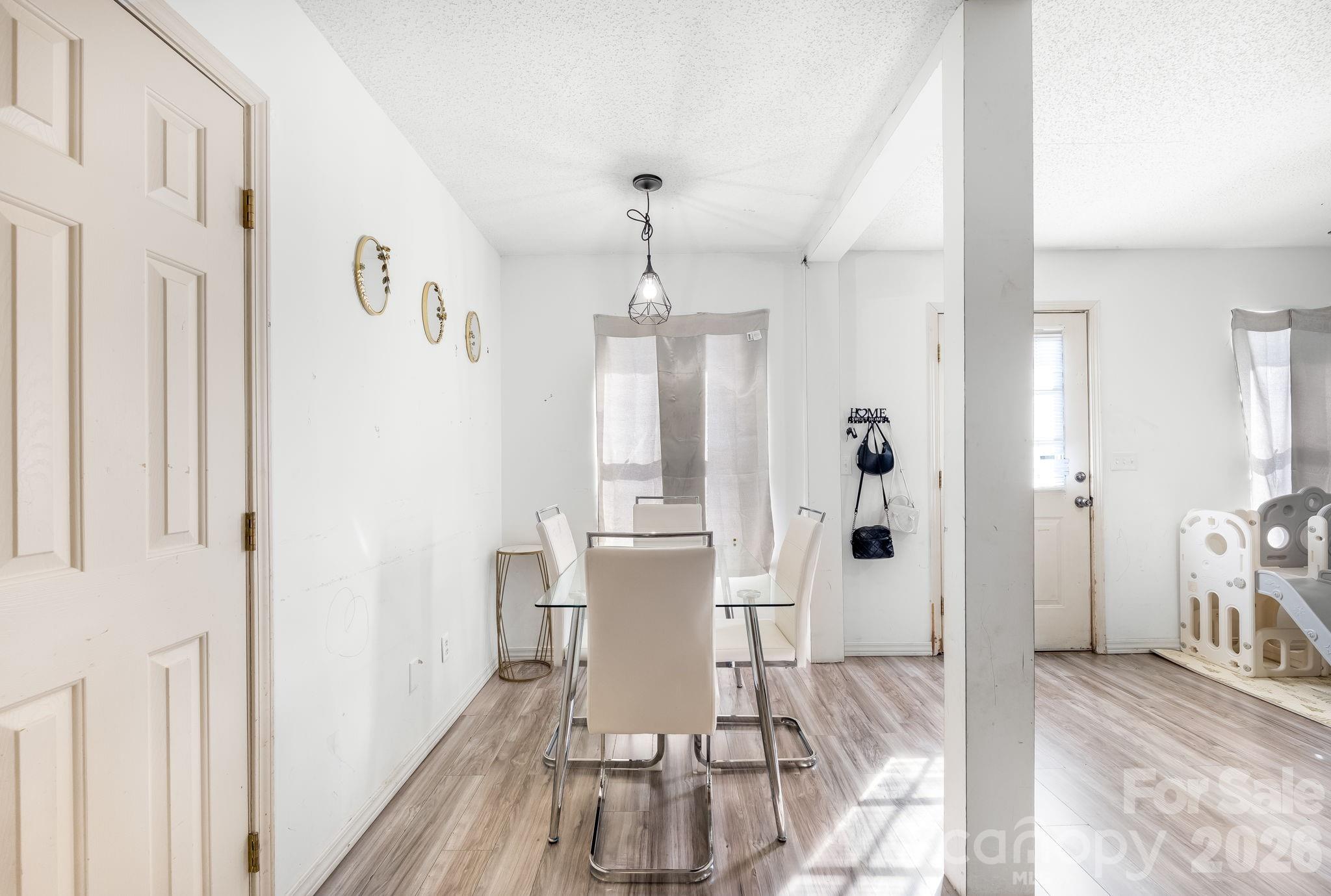 3761 Herman Sipe Road Conover, NC 28613 - Photo 13 of 27 a view of a dining room with furniture window and wooden floor