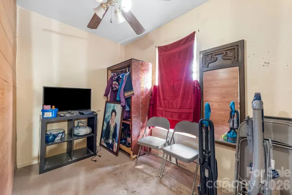 a room with furniture and a flat screen tv
