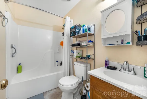 a bathroom with a sink a toilet and a bathtub