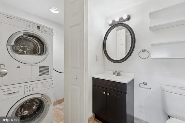 a bathroom with a sink and a washing machine