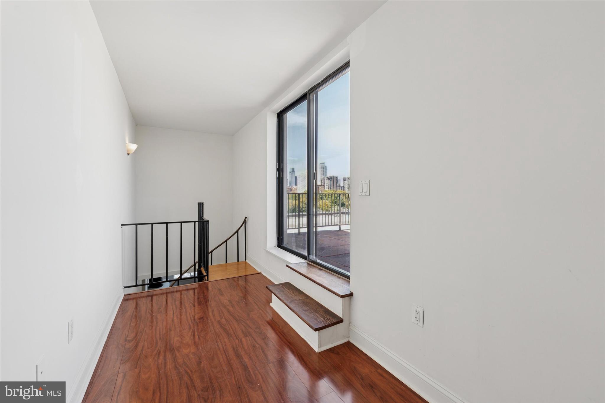 200 Lombard Street, Unit 804 Philadelphia, PA 19147 - Photo 9 of 15 a view of hallway with wooden floor