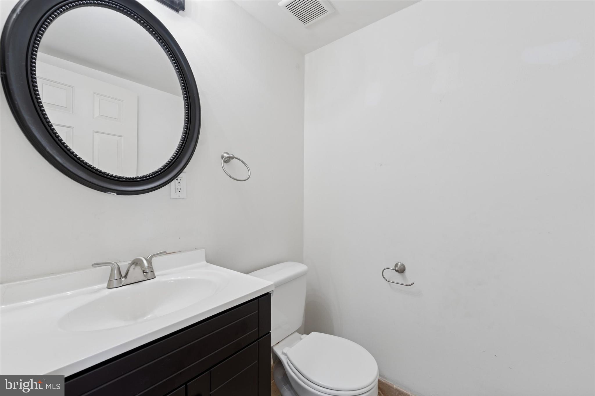 200 Lombard Street, Unit 804 Philadelphia, PA 19147 - Photo 10 of 15 a bathroom with a sink a toilet and a mirror