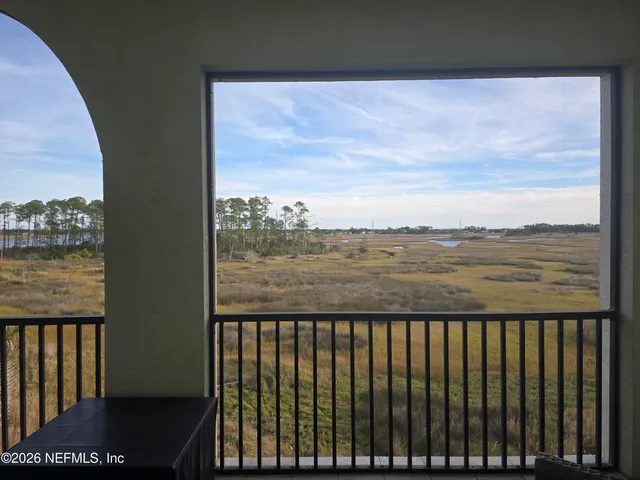 a view of a lake from a balcony