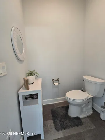a bathroom with a toilet and a sink
