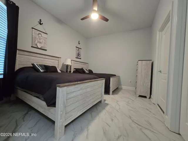 a view of bedroom with furniture
