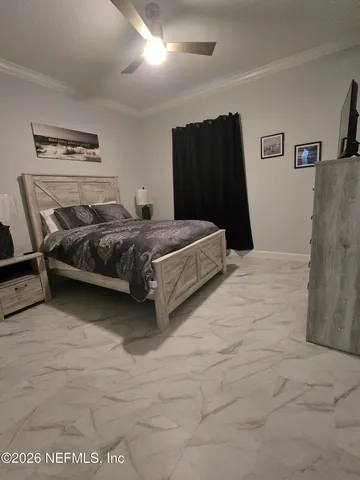 a bedroom with a bed and a furniture