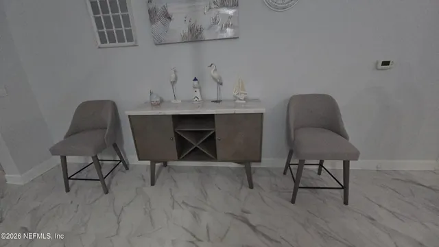 a view of a workspace with furniture