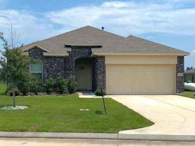1435 Alice Drive Beaumont, TX 77705 - Photo 1 of 11 a front view of a house with a yard