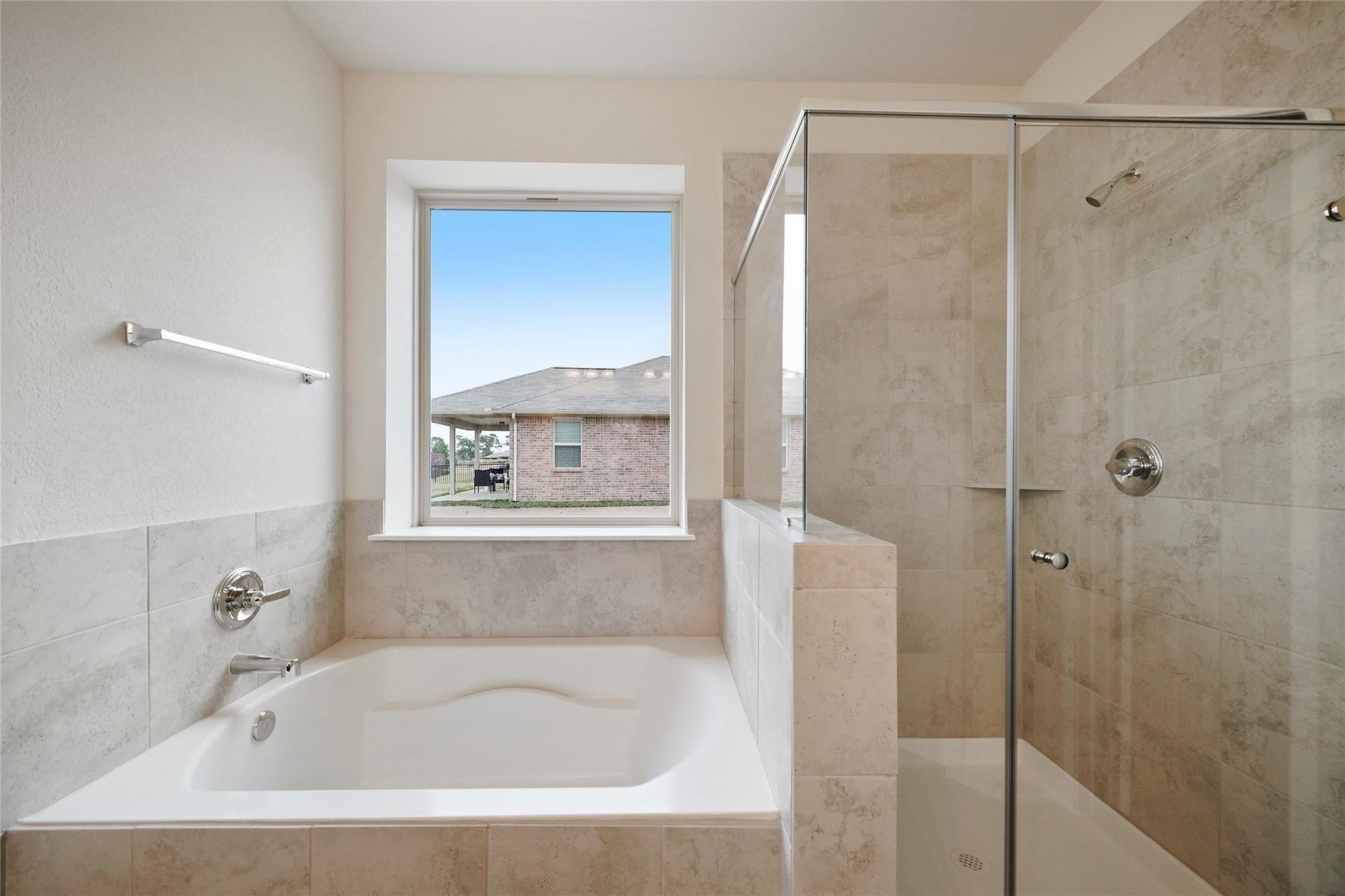 1435 Alice Drive Beaumont, TX 77705 - Photo 6 of 11 a white bath tub sitting next to a shower