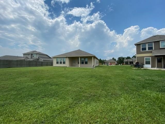 1435 Alice Drive Beaumont, TX 77705 - Photo 10 of 11 a front view of house with yard and green space