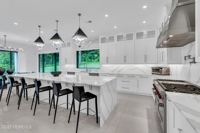 a view of a livingroom with furniture and a large window