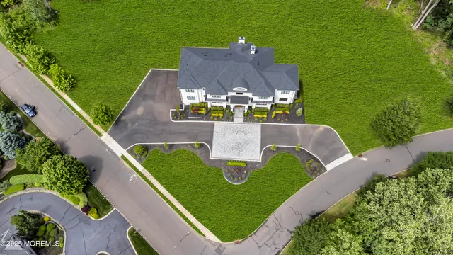 a bathroom with a granite countertop toilet a sink a mirror and shower