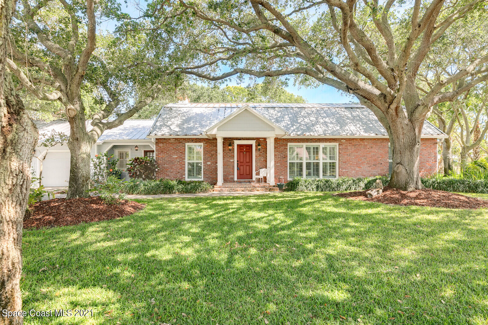 200 Melbourne Avenue Indialantic, FL 32903 - Photo 1 of 62 front view of a house with a yard