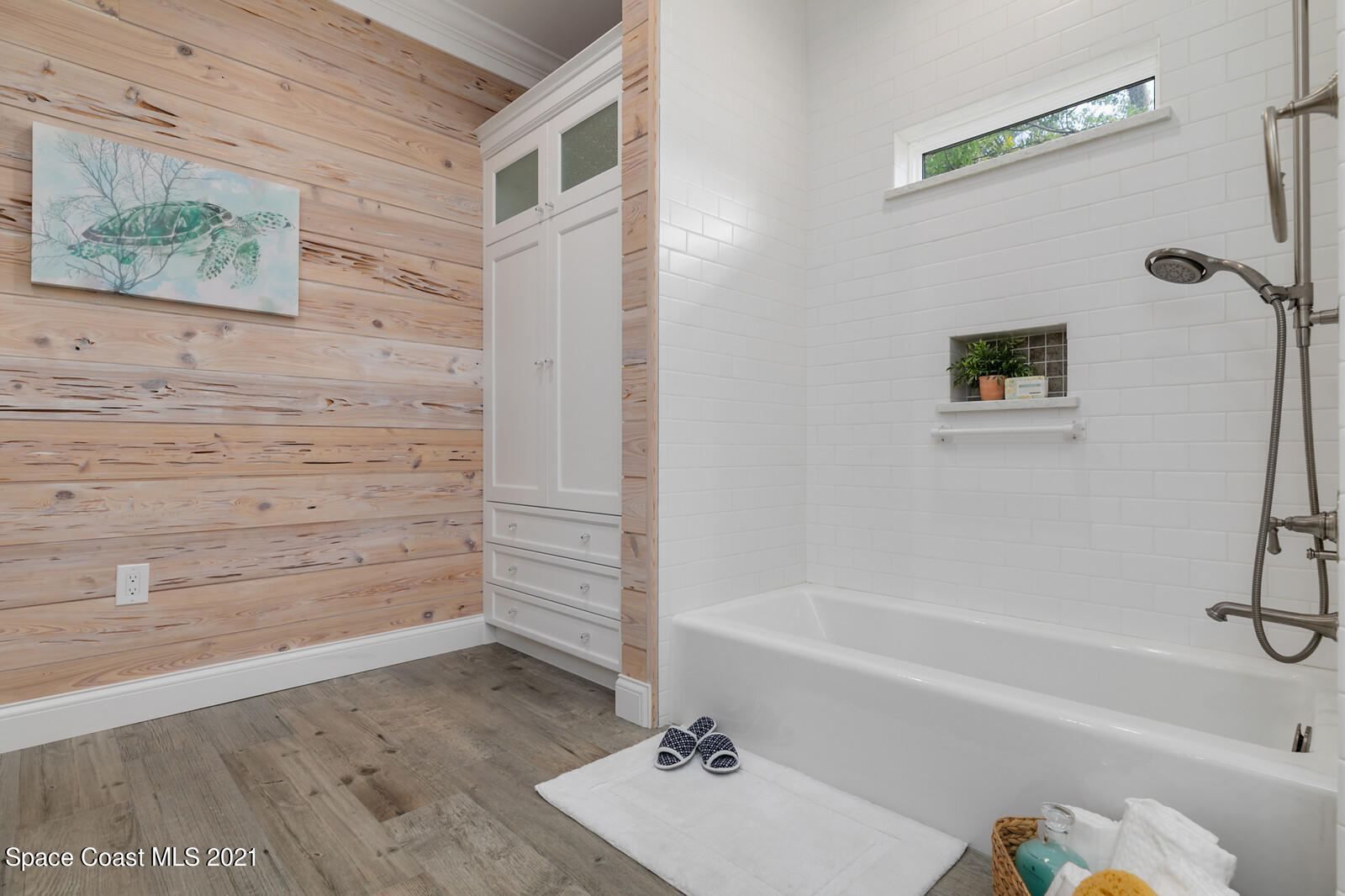 200 Melbourne Avenue Indialantic, FL 32903 - Photo 19 of 62 a bathroom with a bathtub and a shower