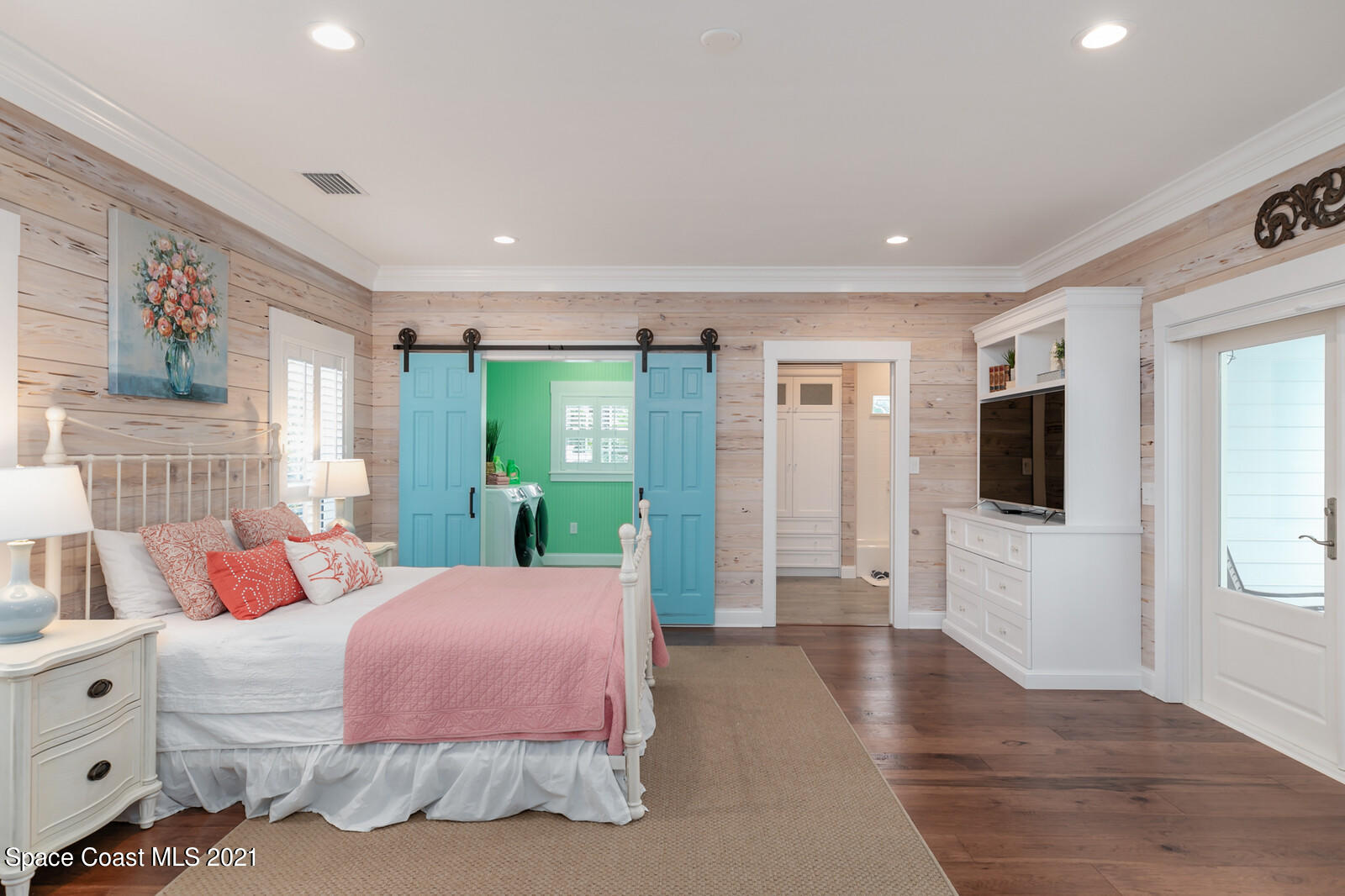 200 Melbourne Avenue Indialantic, FL 32903 - Photo 22 of 62 a bedroom with a bed and a flat screen tv