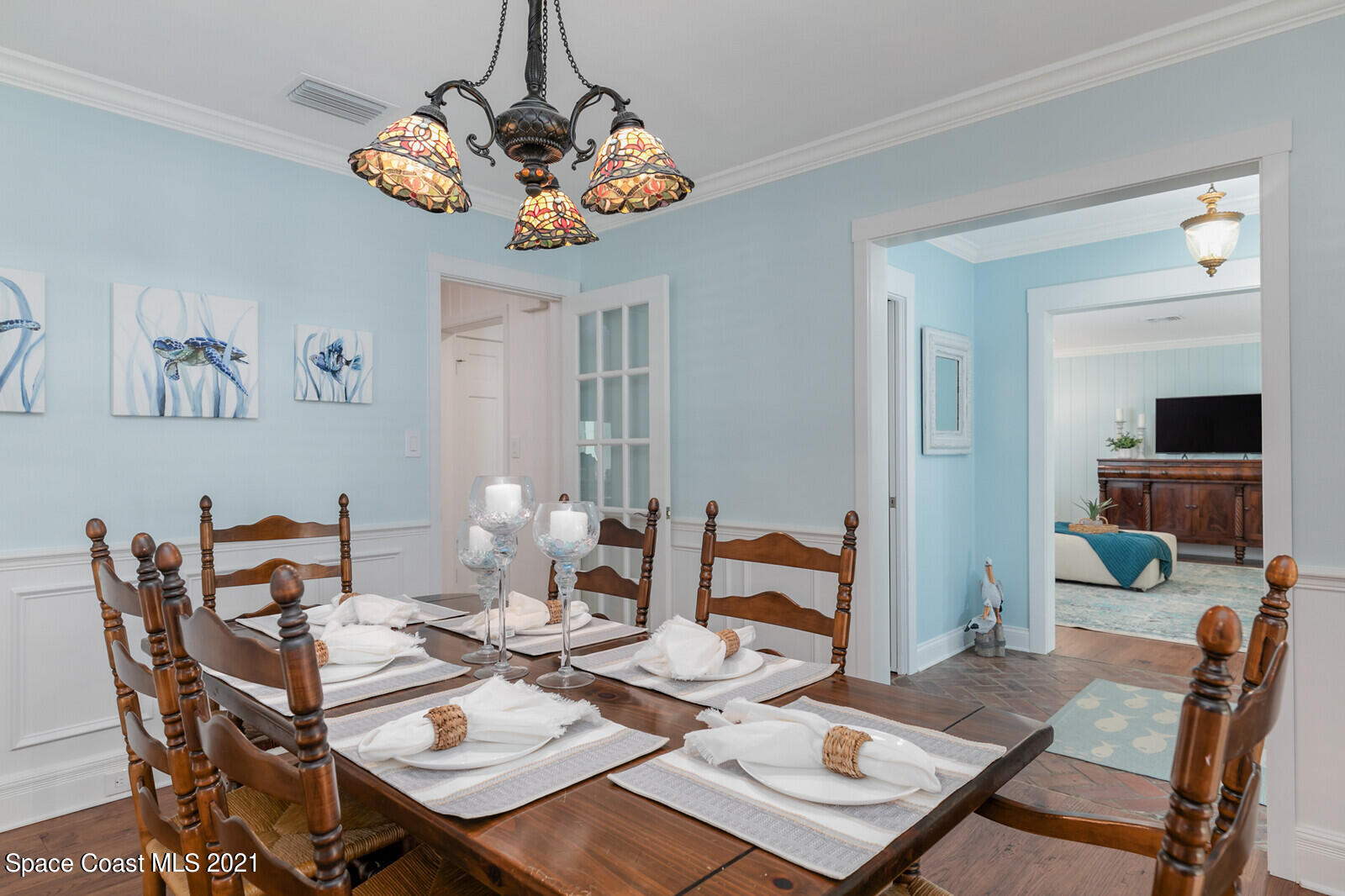 200 Melbourne Avenue Indialantic, FL 32903 - Photo 38 of 62 a view of a dining room with furniture a chandelier and wooden floor