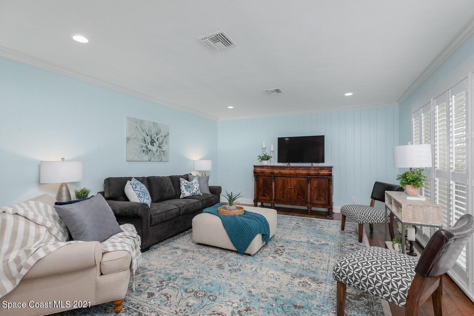 200 Melbourne Avenue Indialantic, FL 32903 - Photo 40 of 62 a living room with furniture and a flat screen tv