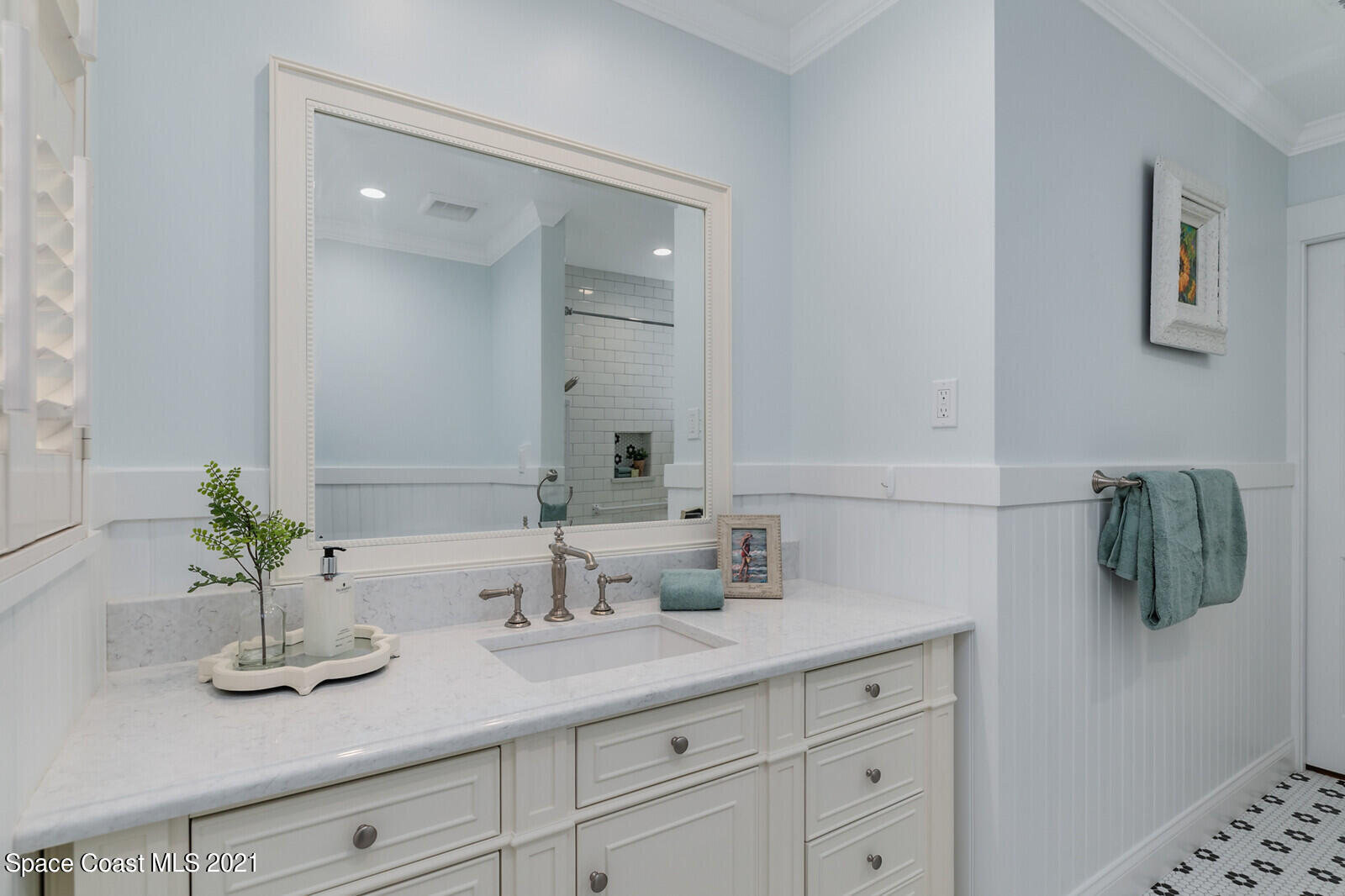 200 Melbourne Avenue Indialantic, FL 32903 - Photo 42 of 62 a bathroom with a sink double vanity and mirror