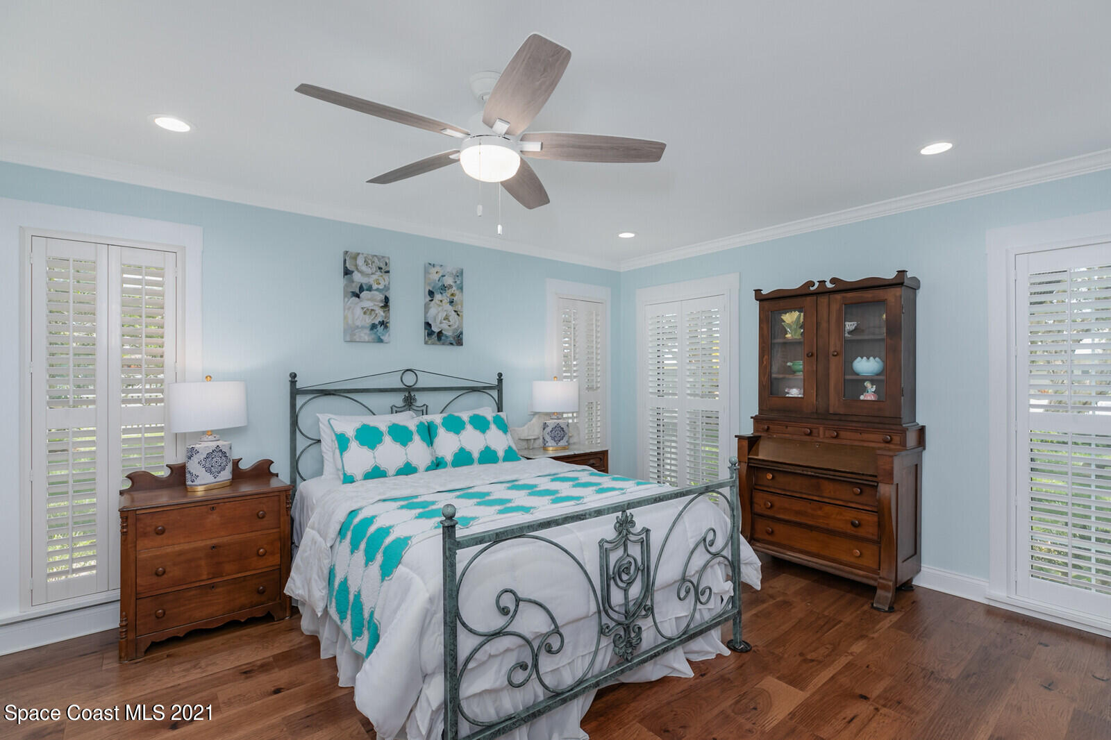 200 Melbourne Avenue Indialantic, FL 32903 - Photo 44 of 62 a bedroom with a bed and a chandelier