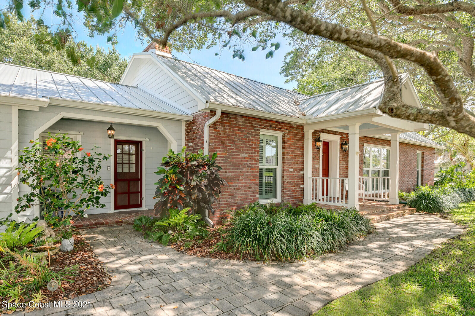 200 Melbourne Avenue Indialantic, FL 32903 - Photo 6 of 62 front view of a house with a small yard