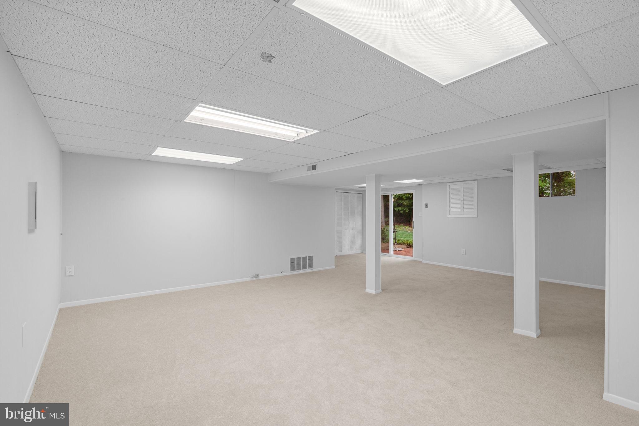 8005 Langbrook Road Springfield, VA 22152 - Photo 44 of 57 New carpet and paint in basement rec room