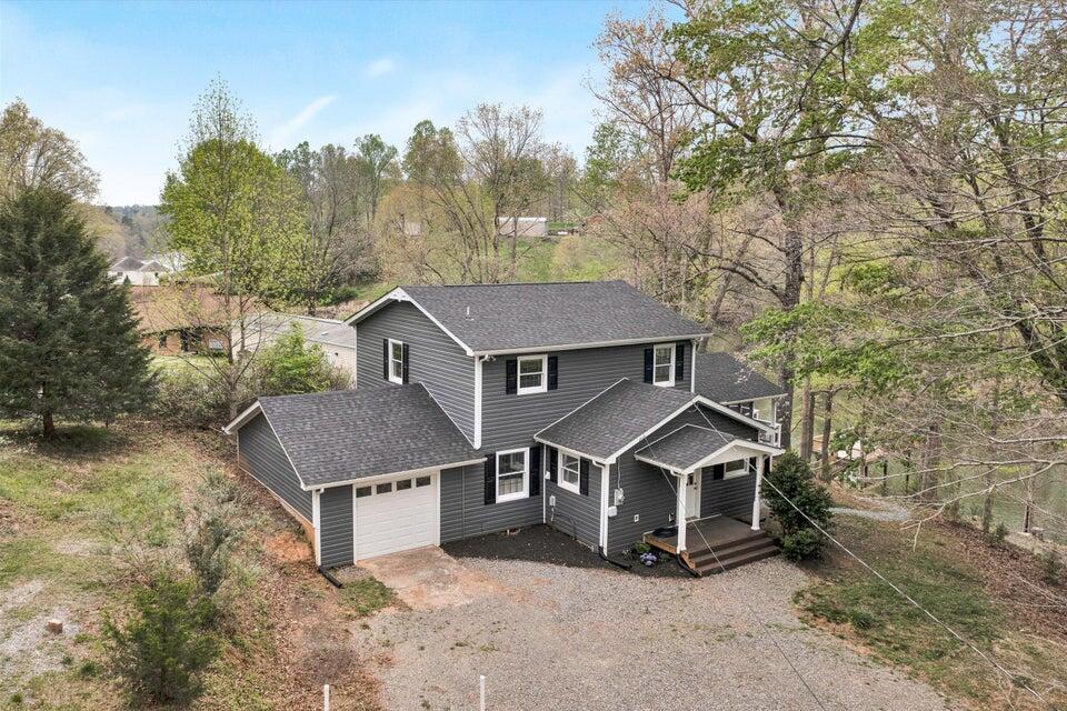1688 Lynville Ford Road Goodview, VA 24095 - Photo 1 of 1 an aerial view of residential house with yard and trees in the background