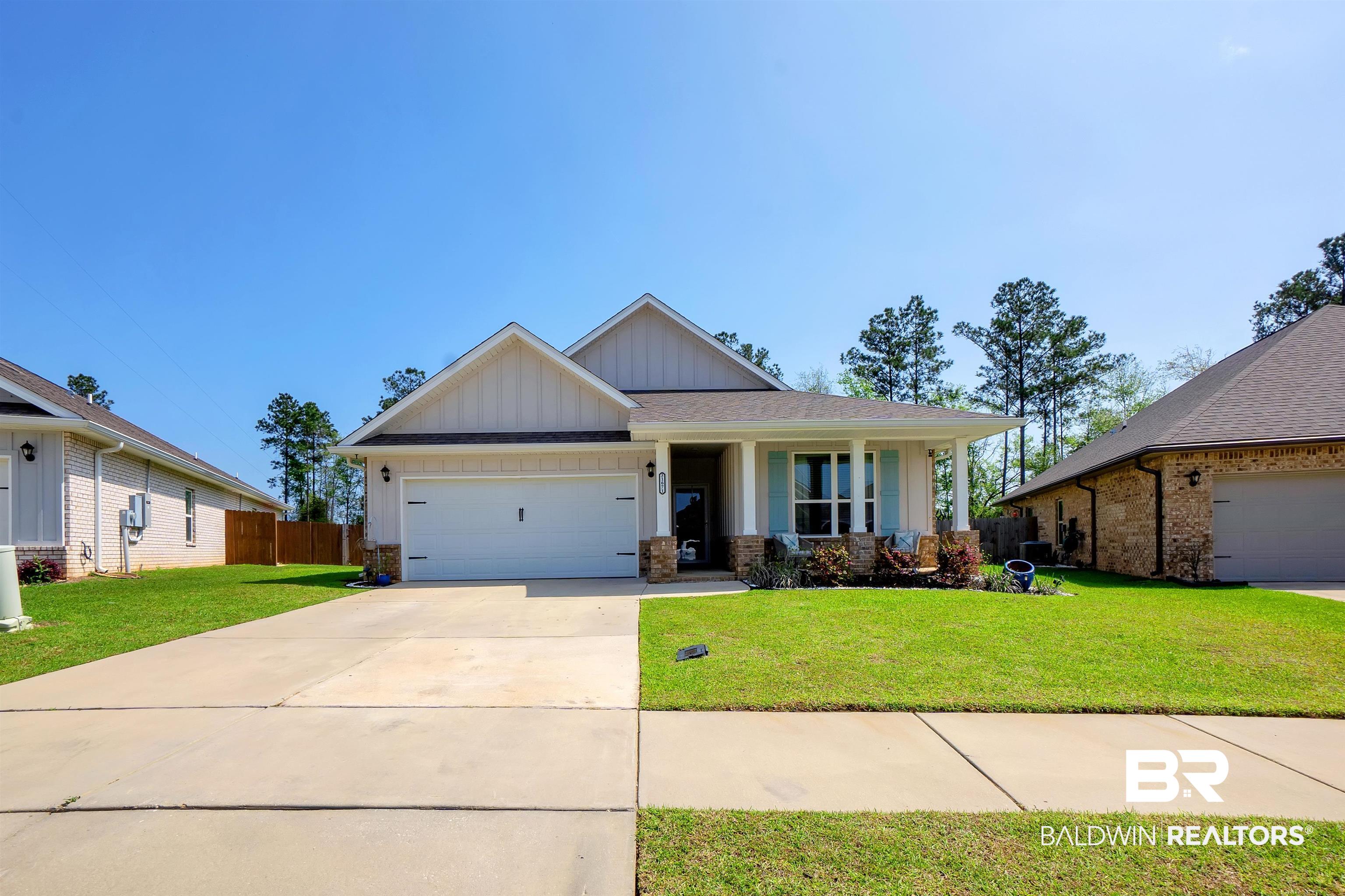 31671 Memphis Loop Daphne, AL 36527 - Photo 1 of 51 Craftsman-style home featuring driveway, an attached garage, a porch, and a front yard