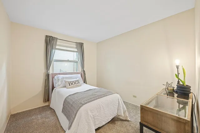 a bedroom with a bed and a sink