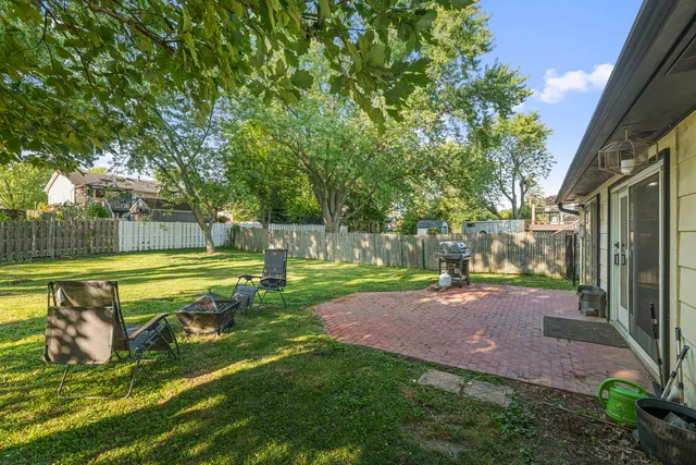a view of a backyard with swimming pool