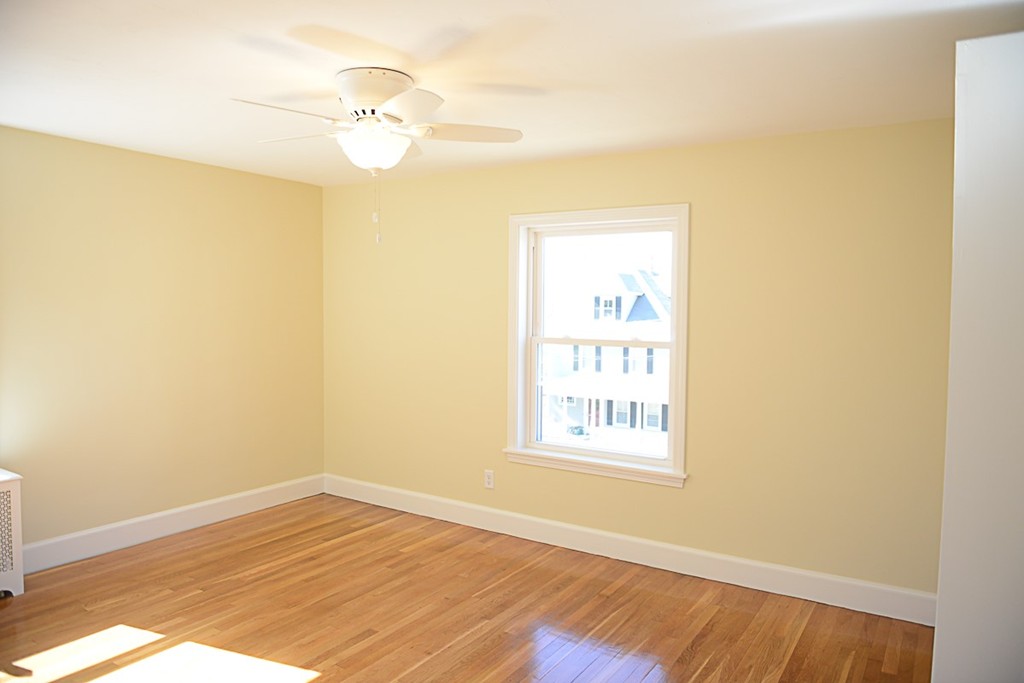 11 Ashmore Road Worcester, MA 01602 - Photo 13 of 14 a view of an empty room with wooden floor and a window