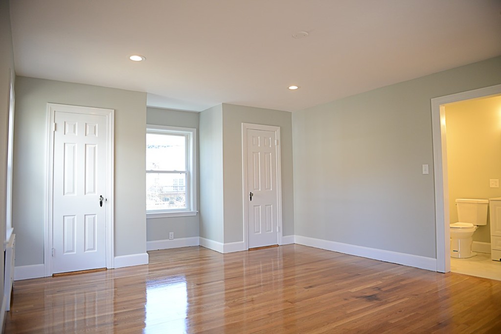 11 Ashmore Road Worcester, MA 01602 - Photo 8 of 14 a view of empty room with wooden floor and fan