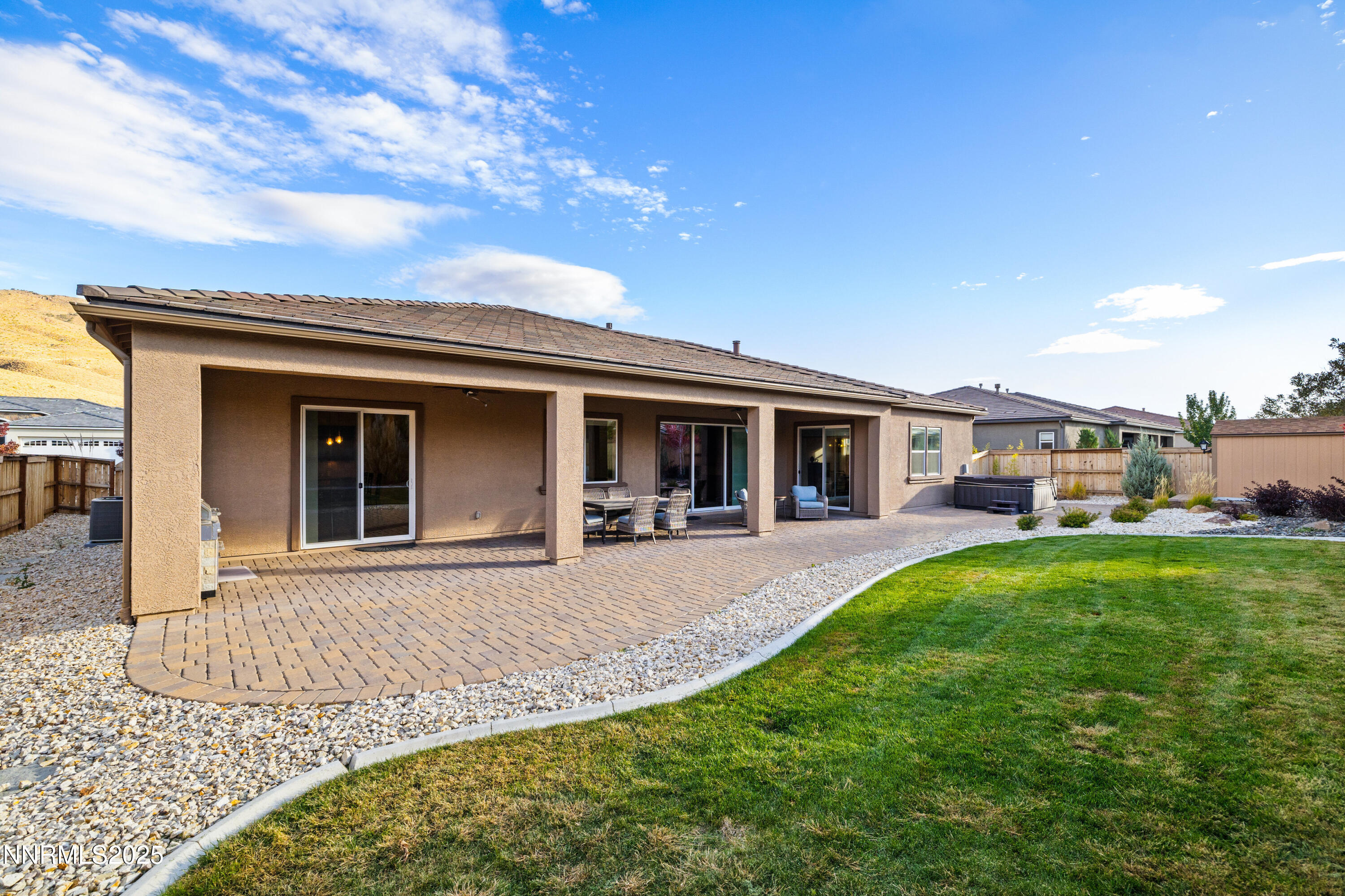 9845 Sea Breeze Lane Reno, NV 89521 - Photo 28 of 41 a front view of a house with a garden and porch