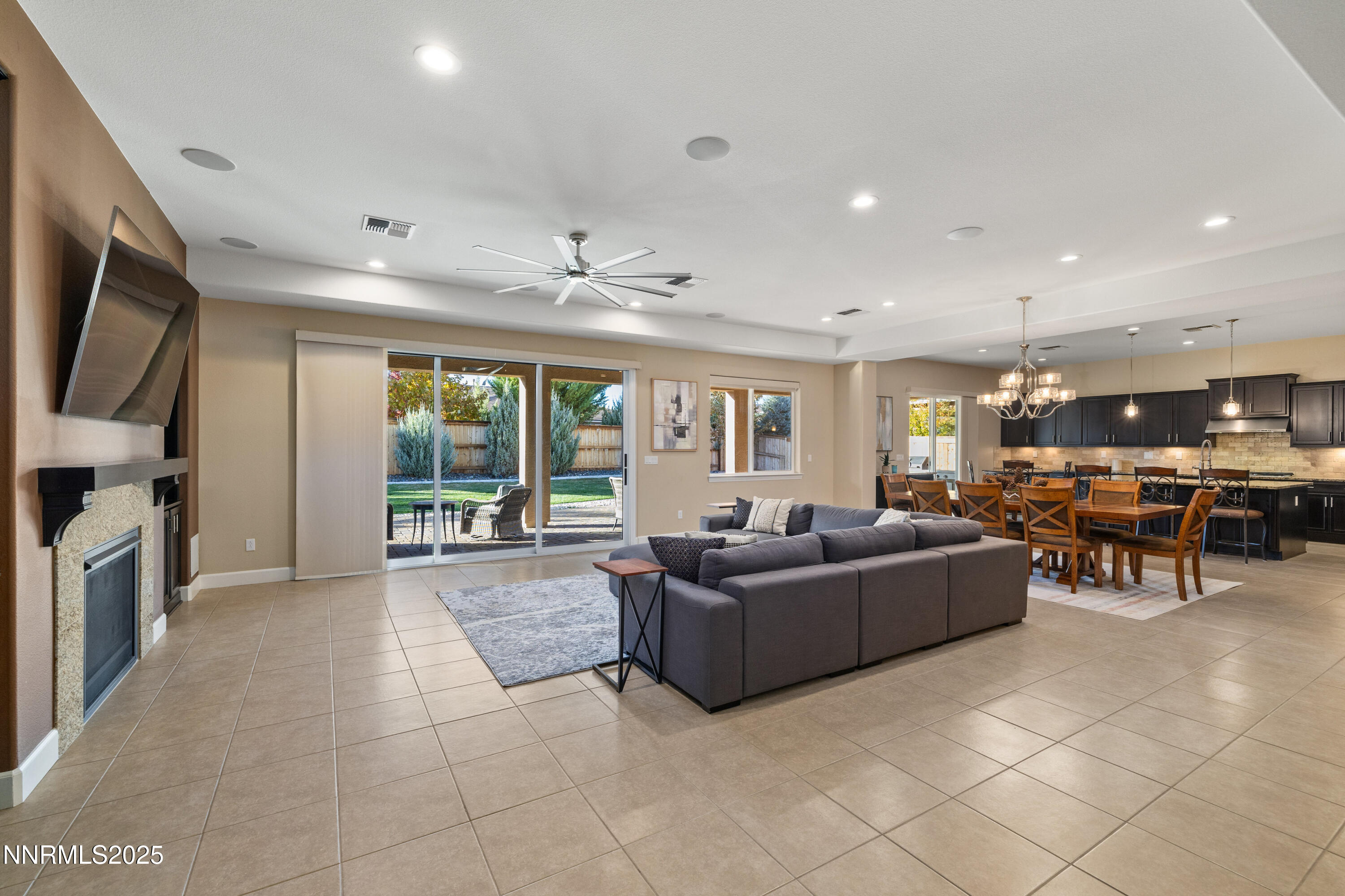 9845 Sea Breeze Lane Reno, NV 89521 - Photo 3 of 41 a living room with furniture and a flat screen tv