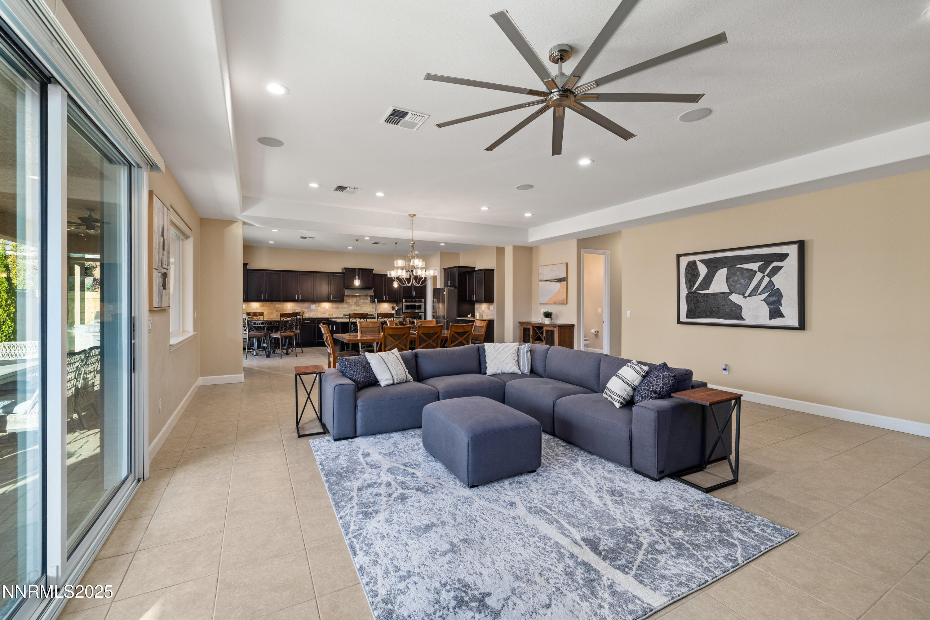 9845 Sea Breeze Lane Reno, NV 89521 - Photo 4 of 41 a living room with furniture kitchen view and a large window